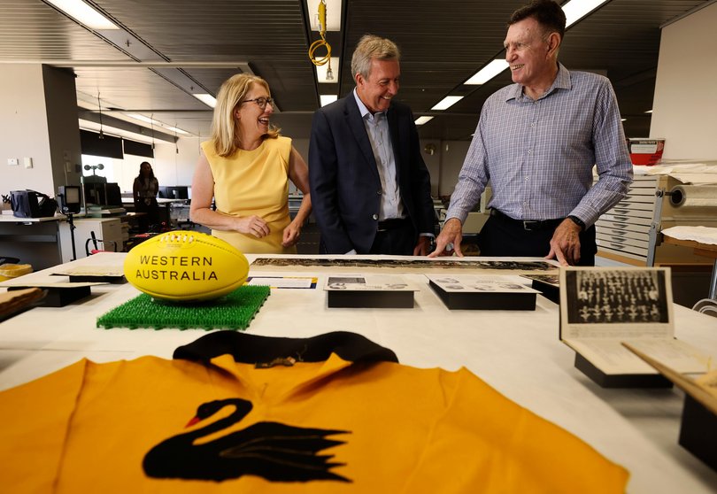 Reece Whitby, Rita Saffioti and Ron Alexander visit the soon-to-be displayed State of Origin exhibit at the State Library.