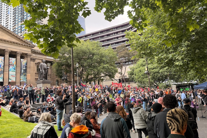 A few hundred counter-protesters had gathered outside the State Library on Sunday morning.