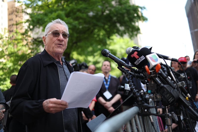 TOPSHOT - US actor Robert De Niro speaks in support of US President Joe Biden outside of Manhattan Criminal Court as former US President and Republican presidential candidate Donald Trump attends his criminal trial for allegedly covering up hush money payments in New York City, on May 28, 2024. De Niro on Tuesday spoke outside the New York court where Donald Trump is standing trial, branding him a dangerous "clown" who will become a dictator for life if reelected. De Niro, a longtime political activist and critic of Trump, has taken a growing role in the campaign to reelect Joe Biden, including starring in a new hard-hitting TV ad for the Democratic Party. (Photo by CHARLY TRIBALLEAU / AFP) (Photo by CHARLY TRIBALLEAU/AFP via Getty Images)