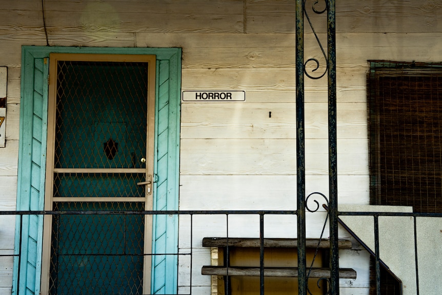 A house in Balmoral, with a sign on it saying 'Horror'.