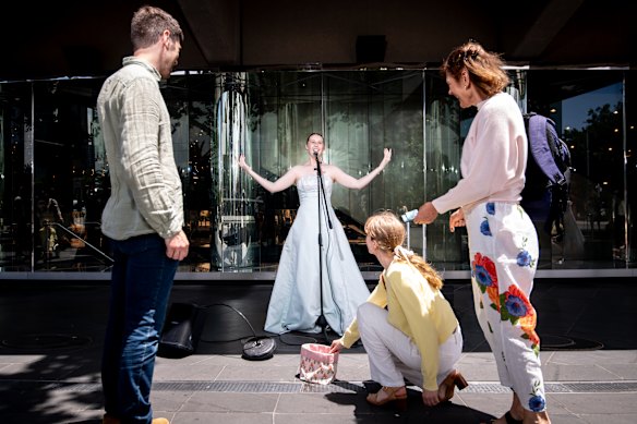 Opera-singing busker Lucy Diggerson, who wears her mother’s wedding dress while performing in the St Kilda Road arts precinct.