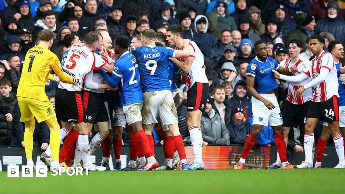 Players from Southampton and Portsmouth confront eachother after a heavy challenge in the game
