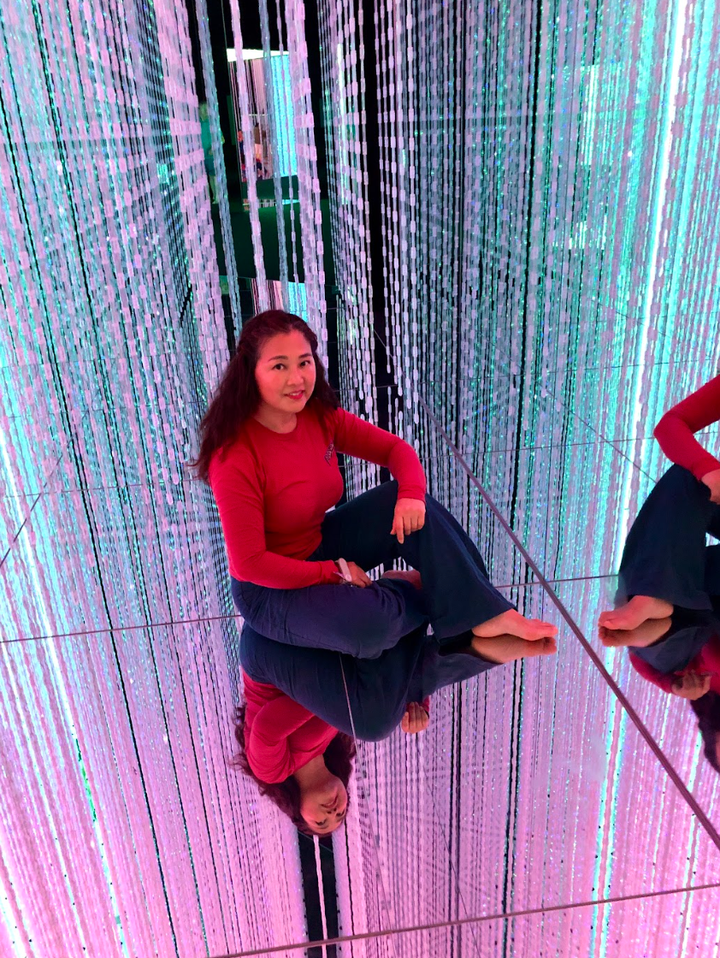 The author at an immersive light installation at teamLab Planets TOKYO in 2024.