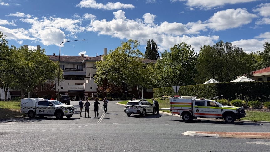 Police cars and officers outside the Hyatt Hotel in Canberra.