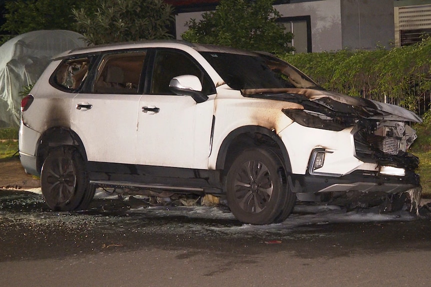 A burnt-out SUV found following a shooting in Sydney's west