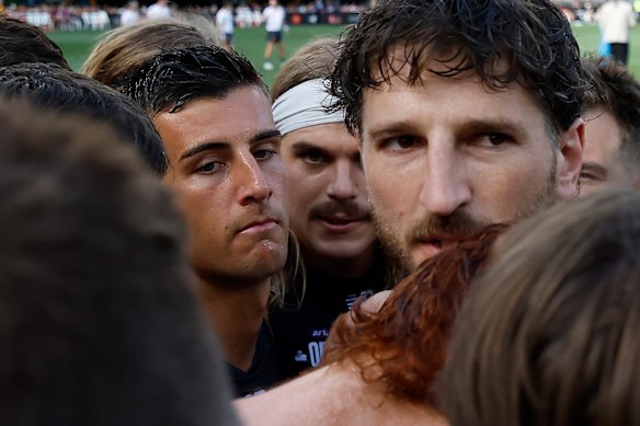 Nick Daicos, Bailey Smith and Marcus Bontempelli of Victoria are seen during quarter time.