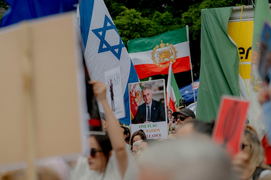 Poster of Reza Pahlavi at rally 140226