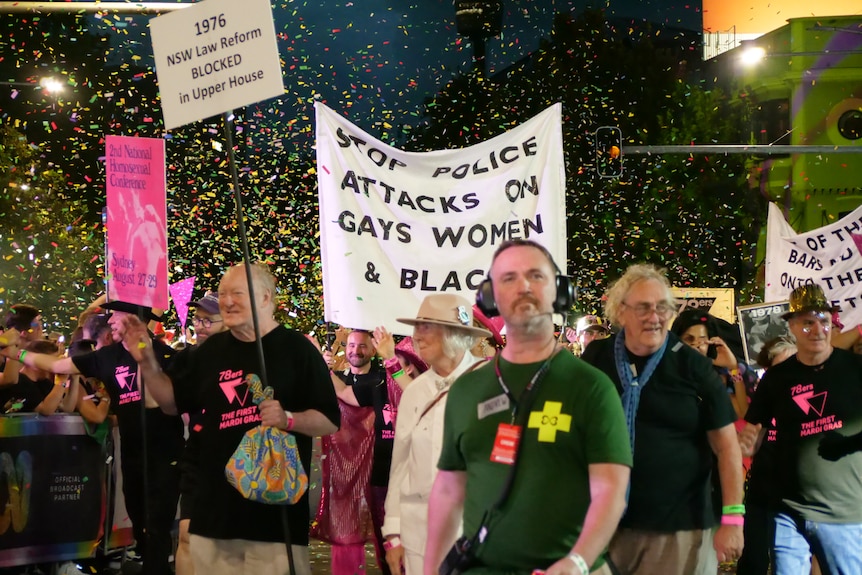 A group of people carrying signs
