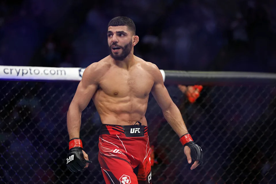 Aug 20, 2022; Salt Lake City, Utah, USA; Amir Albazi (red gloves) reacts after defeating Francisco Figueiredo (blue gloves) during UFC 278 at Vivint Arena. Mandatory Credit: Jeffrey Swinger-USA TODAY Sports