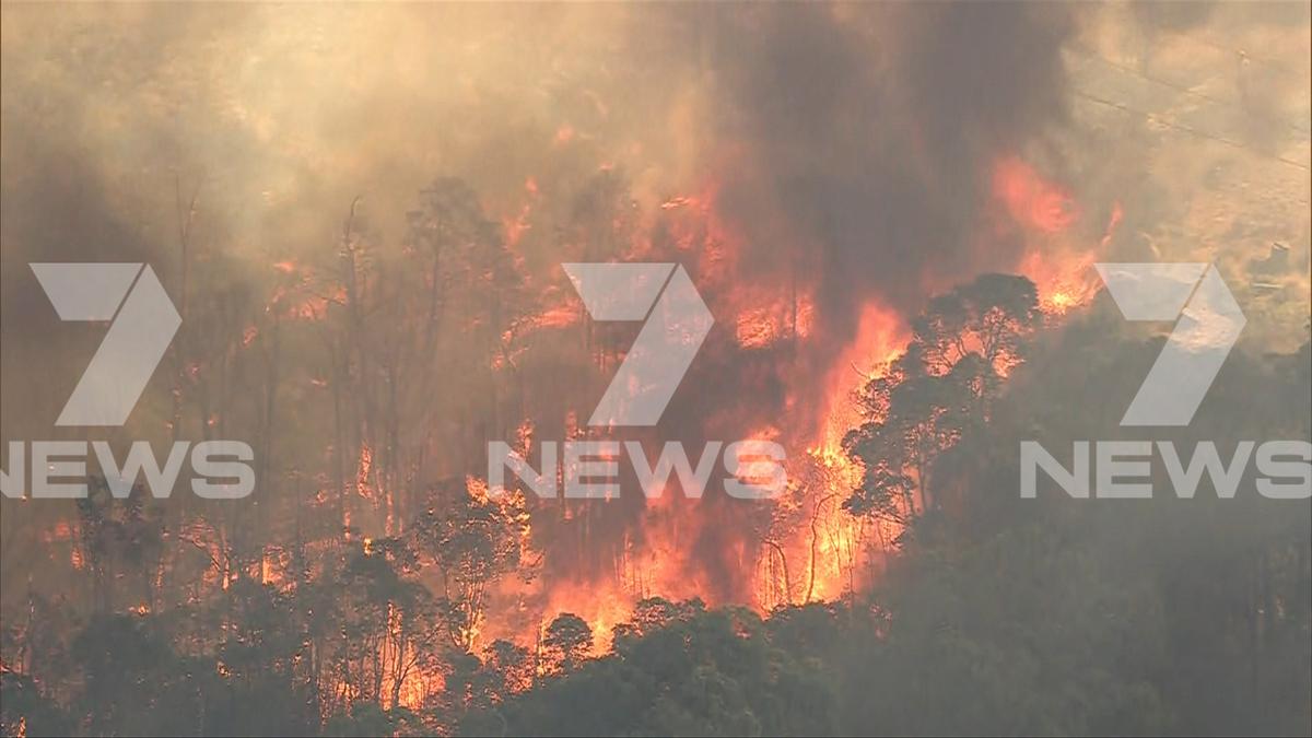 Roads closed as out of control bushfire threatens lives and homes in Perth Hills