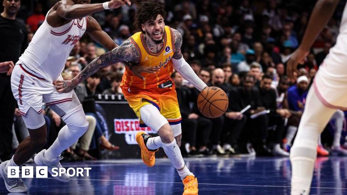 LaMelo Ball of the Charlotte Hornets goes past Amen Thompson of the Houston Rockets