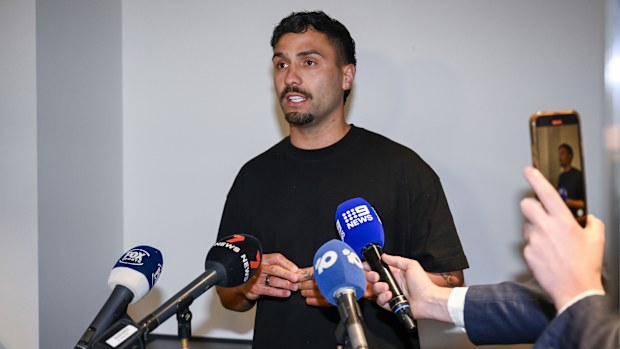 ADELAIDE, AUSTRALIA - SEPTEMBER 02: Suspended Adelaide Crows AFL player Izak Rankine speaks to the media at Adelaide Airport on September 02, 2025 in Adelaide, Australia. Rankine returns home  from his overseas trip, speaking publicly for the first time since he was suspended for a homophobic slur in the AFL match on August 16th. (Photo by Mark Brake/Getty Images)