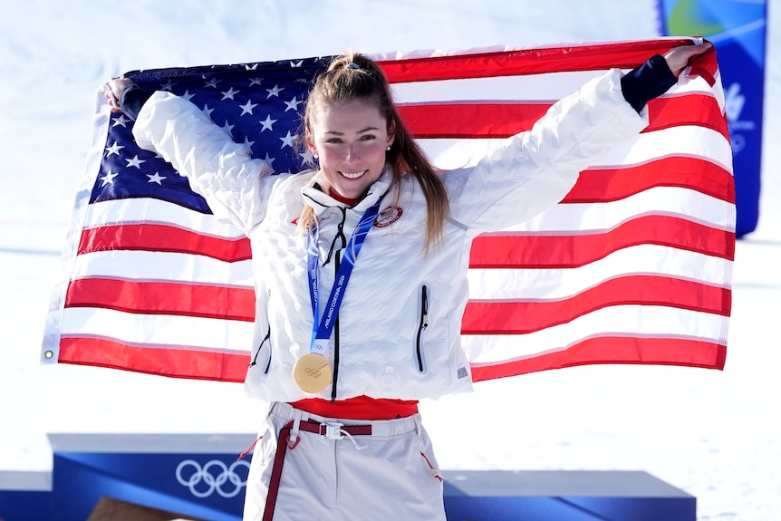 Mikaela Shiffrin celebrates after winning the gold medal