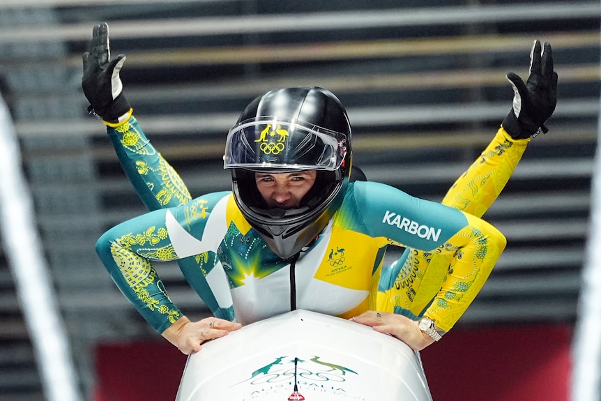 Bree Walker and Kiara Reddingius's arms celebrate in the bobsleigh
