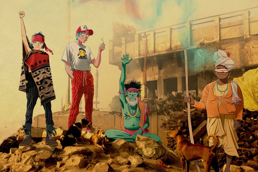 4 cartoon members of Gorillaz pose atop a rocky outpost in Indian-inspired outfits