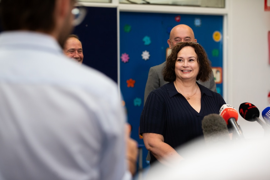Crystal Miller speaking at a press conference.