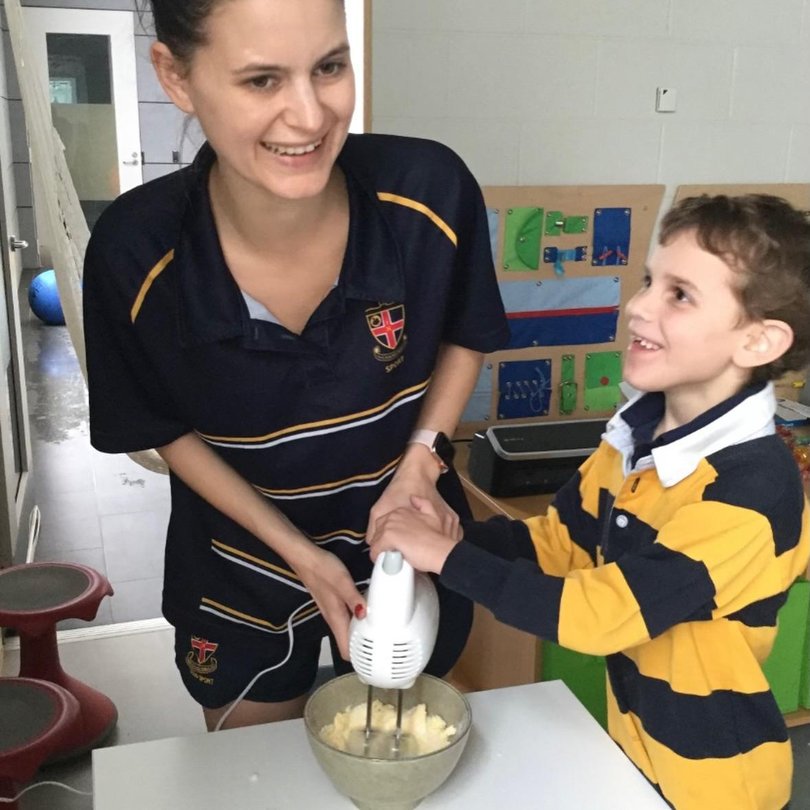 Maddie Page with one of the Clune brothers. 