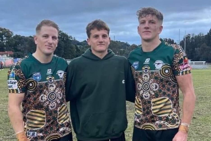 Three men in rugby league attire