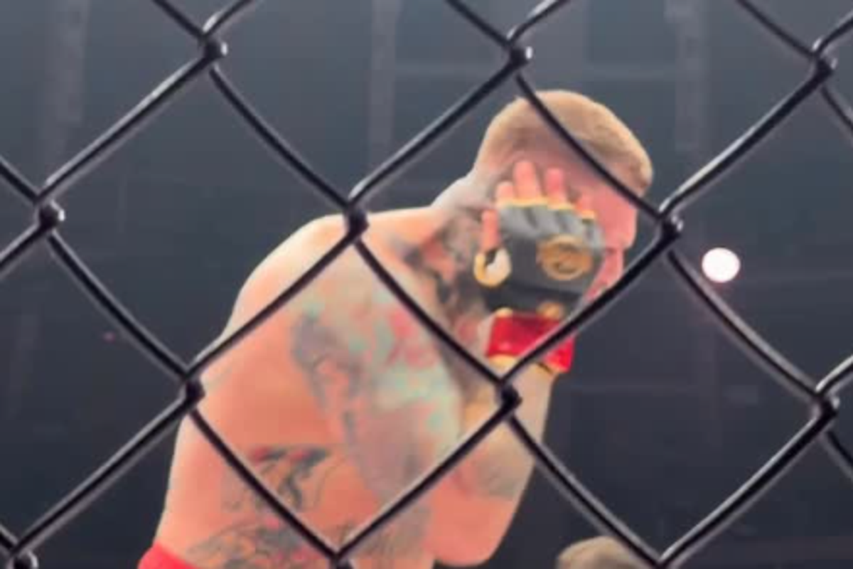 MMA fighter Vaclav Mikulasek clutches his ear after being bitten by Pavol Vasko (@clashmmacom/Instagram)