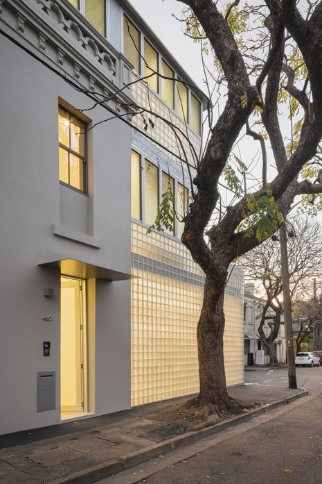 The new rear wing abuts the original facade but is set back slightly to clearly articulate new from old.