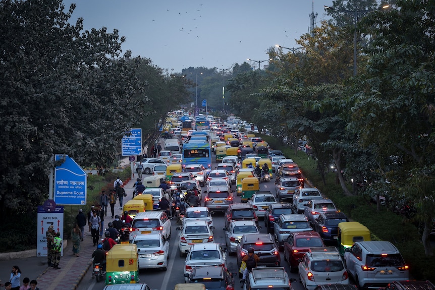Vehicles queue in a long traffic jam in New Delhi