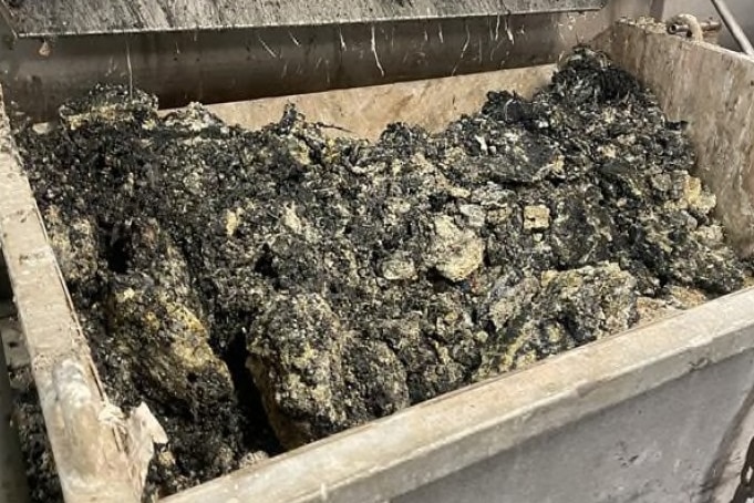 A bin full of debris balls.