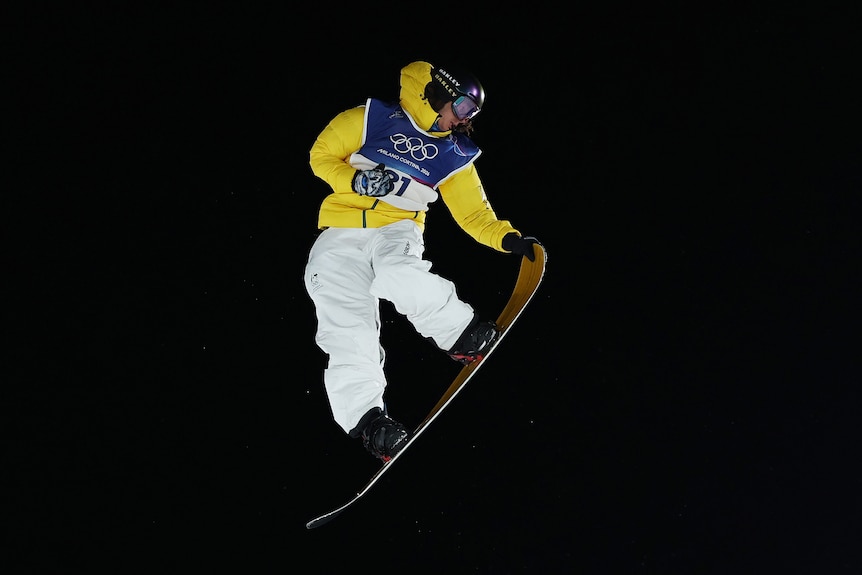 Valentino Guseli grabs the tail of his board.