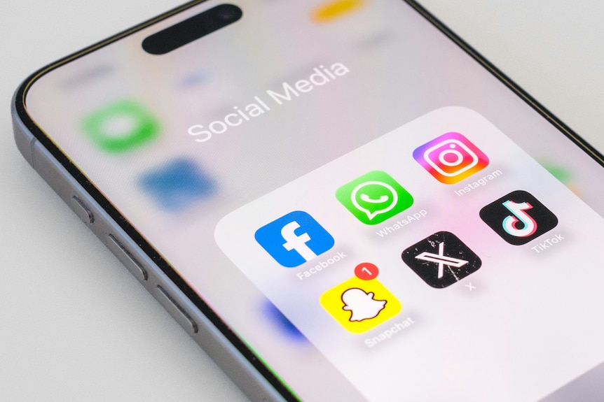 Generic image of a phone displaying a folder of social media apps