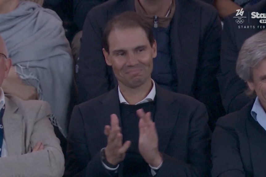 Rafael Nadal applauds in the stands at the Australian Open.