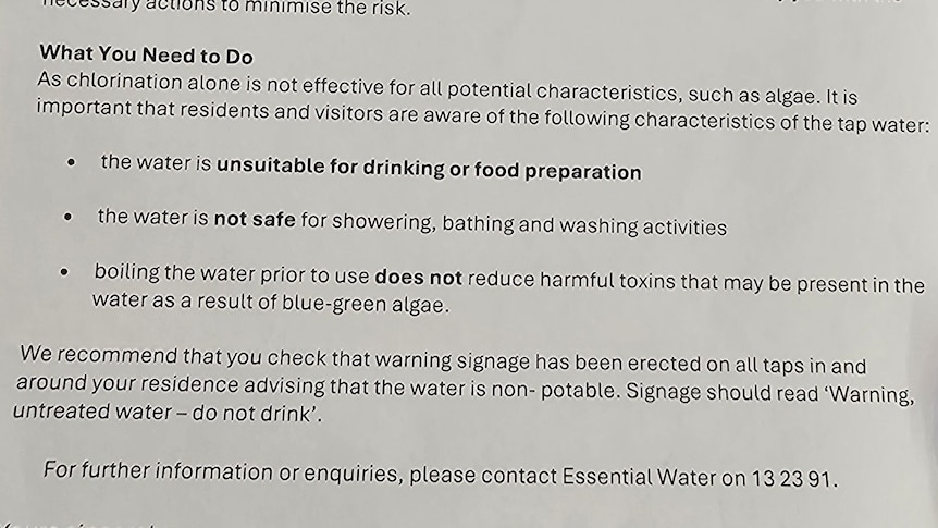 A close-up of a letter warning that water is not safe to wash in.