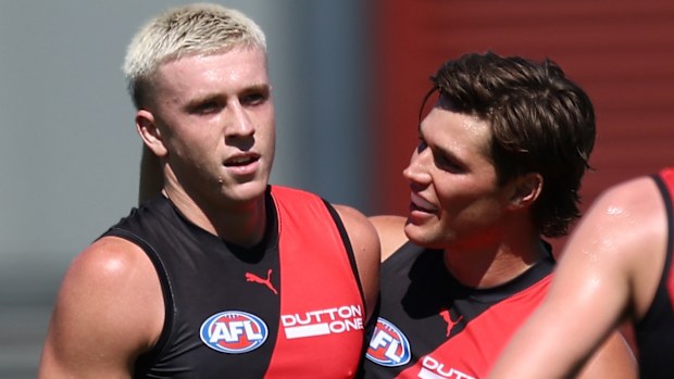 Nate Caddy of the Bombers celebrates a goal with Sam Durham.