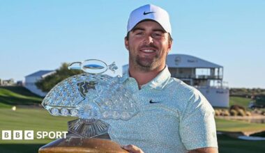 Chris Gotterup holds the Phoenix Open trophy