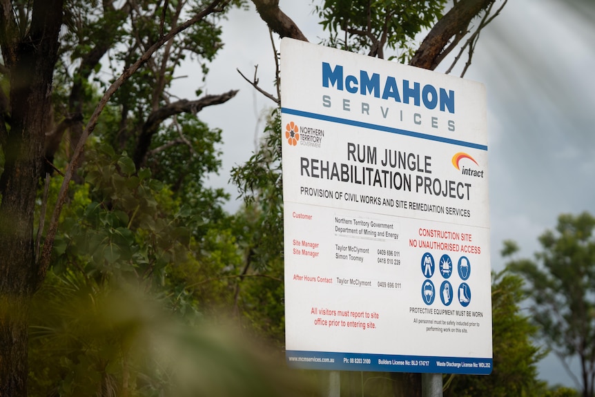 A sign outside a mine reads: RUM JUNGLE REHABILIATION PROJECT