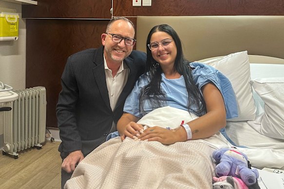 Isabelle Metaxotos (right) with Dr Simon Gordon in hospital after he surgically removed her left ovary and fallopian tube in 2025.