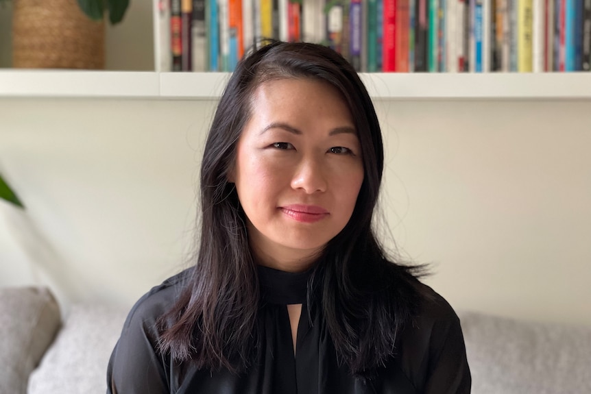 A headshot of Michelle Lim, a woman of Asian heritage with long brown hair.