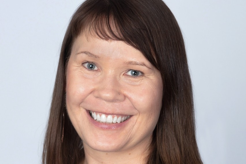 a picture of Bianca, smiling and dressed in black