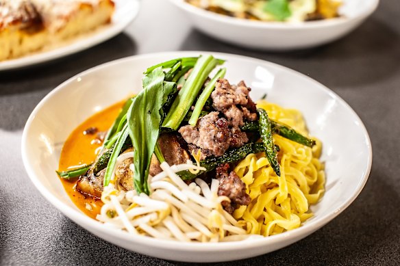 Pork collar Thai red curry with egg noodles and green beans.