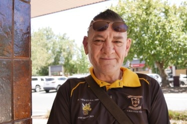 A man looks at a camera