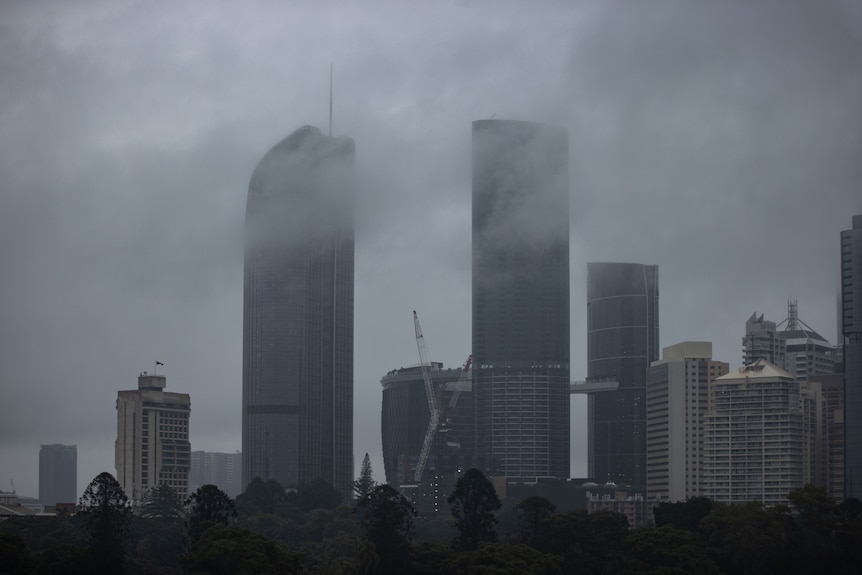 Wide shot of Brisbane's CBD under grey skies.