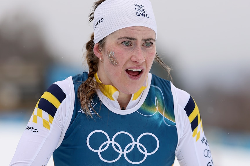 A close-up of a skier looking shocked