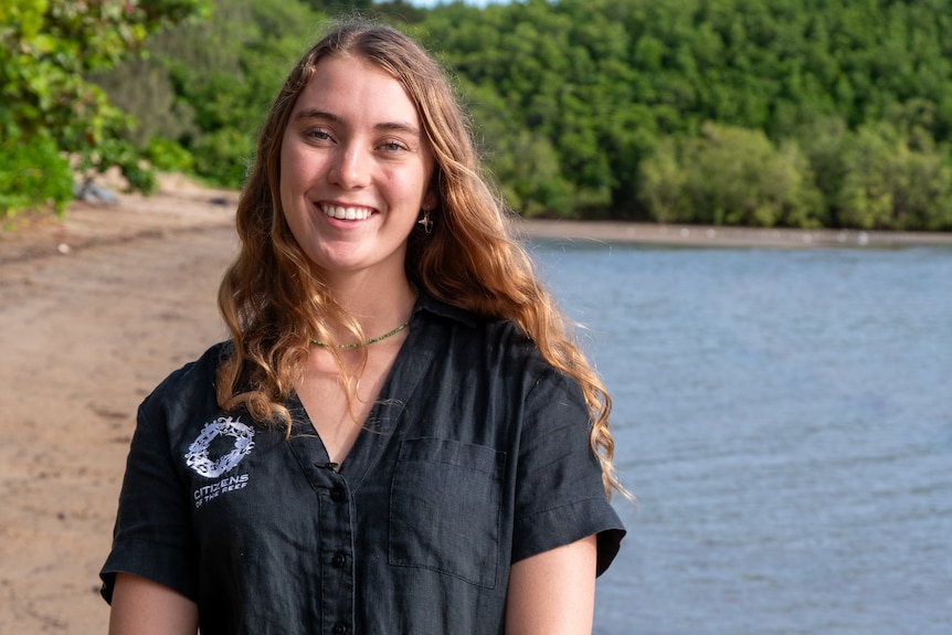 23-year-old woman on a tropical beach. Mangrove backdrop.