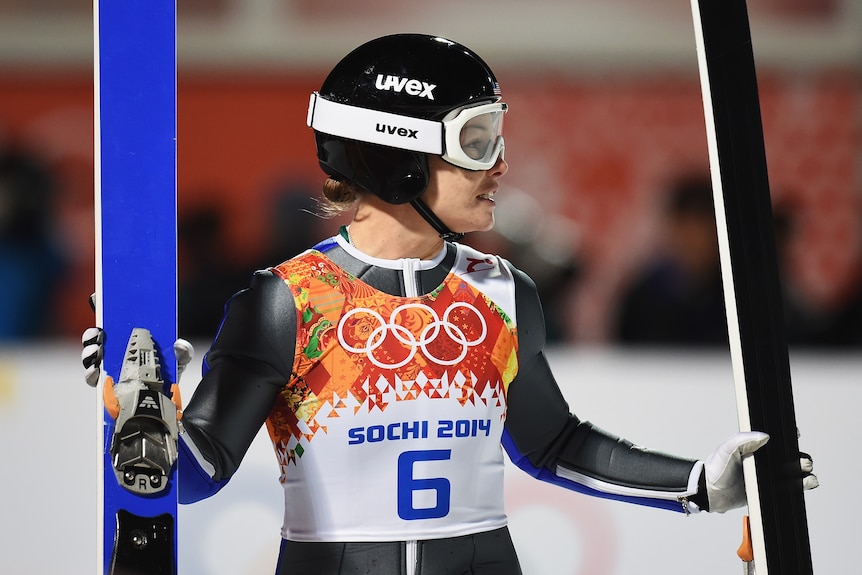 Lindsey Van holds her skis