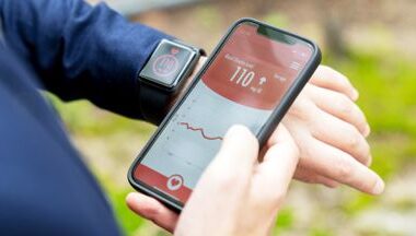 Person checks blood glucose on smartwatch