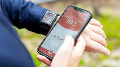 Person checks blood glucose on smartwatch