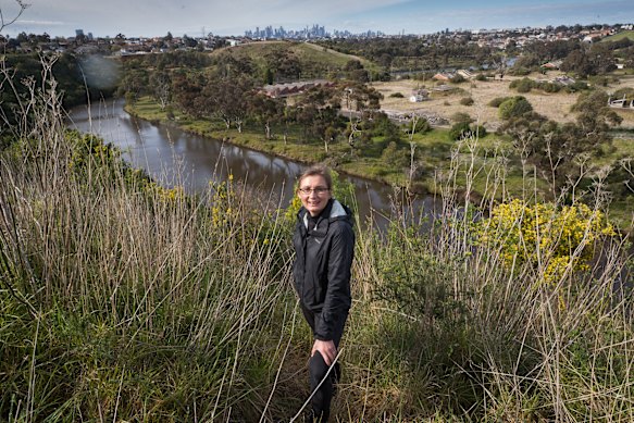 Maribyrnong River advocate Dr Nicole Kowalczyk in Essendon West, with a Melbourne CBD view. 
