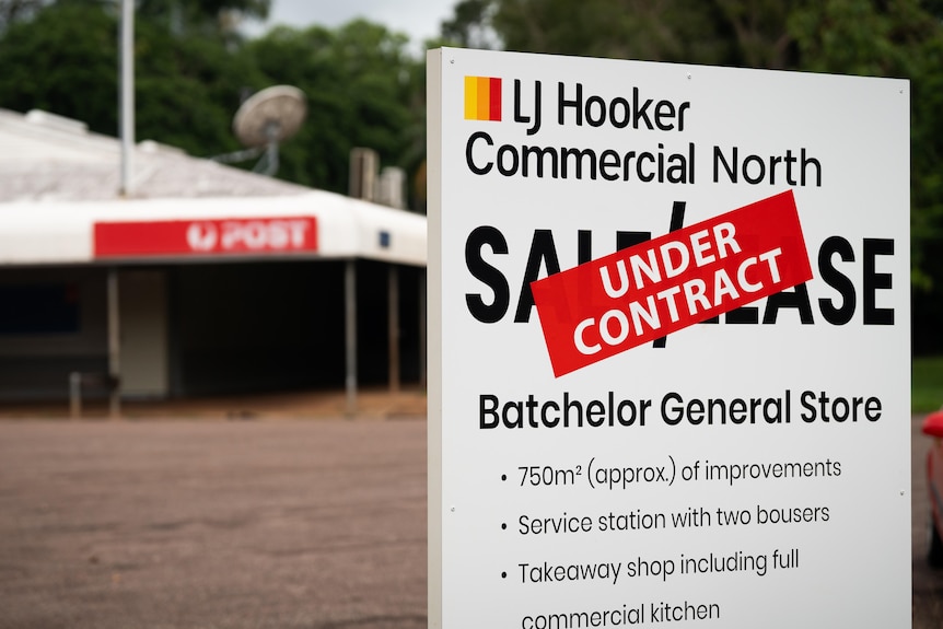 A property sign in front of a general store reads: UNDER CONTRACT