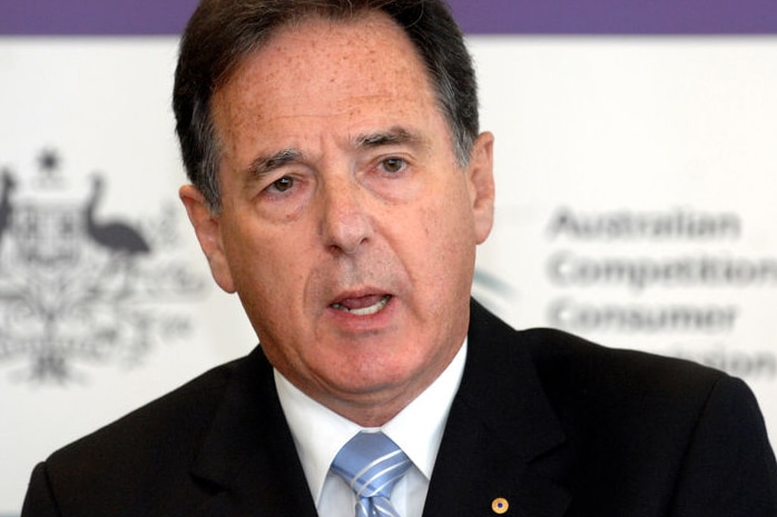 Graeme Samuel in a suit jacket looks at the camera