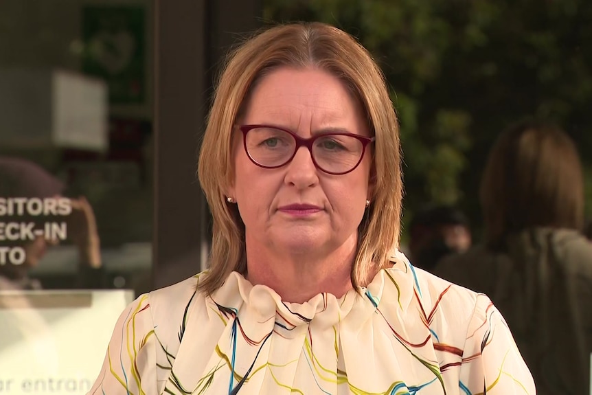 Jacinta Allan has a neutral expression at a press conference outside parliament on February 19, 2026.
