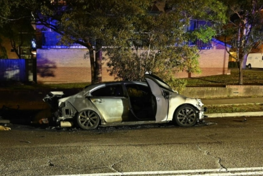 A burnt out white vehicle
