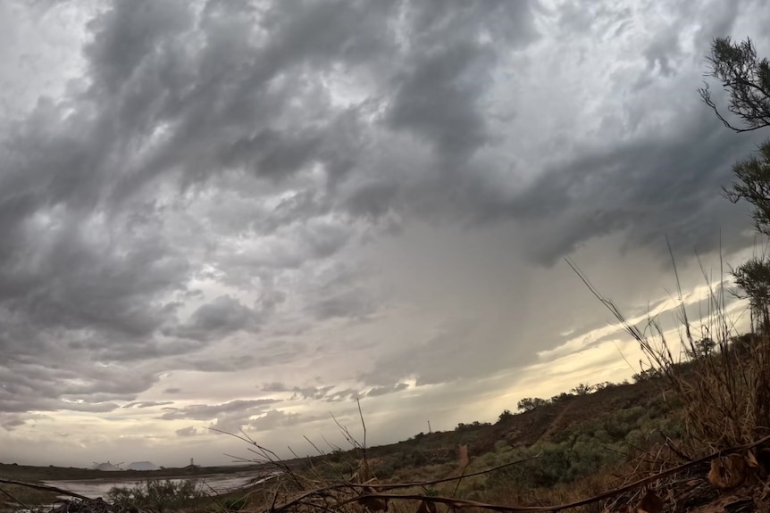 Shot of grey clouds and rain in the sky above Onslow during the cyclone.